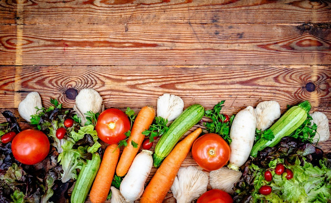 Fresh colorful vegetables arranged on a wooden table