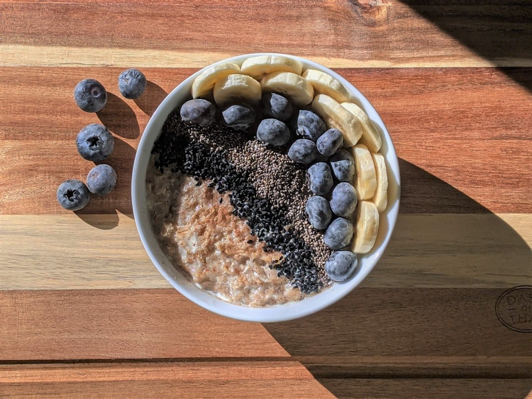 Oatmeal breakfast bowl with berries, seeds, and fruit