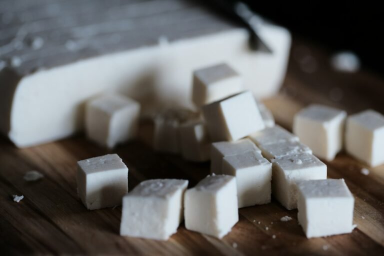Prepared soy-based food on a cutting board, illustrative frozen tempeh cooking image
