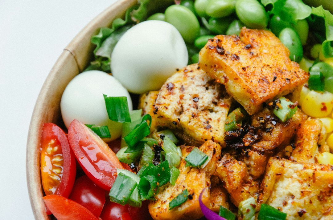 Seasoned plant-based bowl illustrating marinated tofu and vegetables