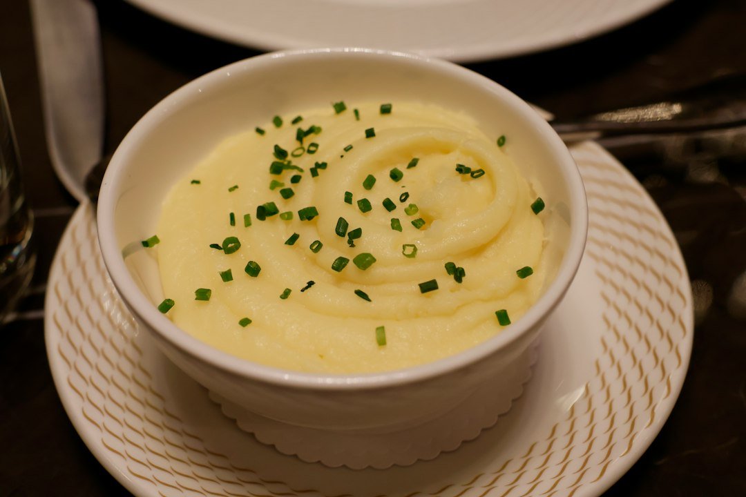 Mashed potatoes served as a side dish with savoury gravy