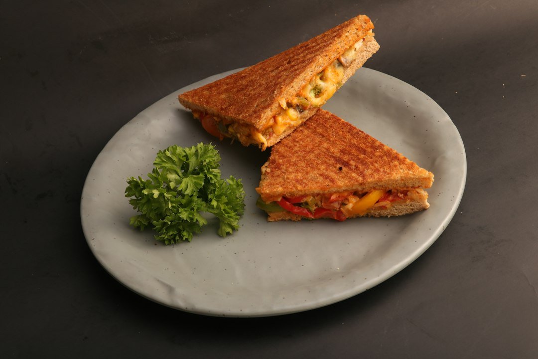 Sandwich with sliced cheese-style filling representing vegan cheese options